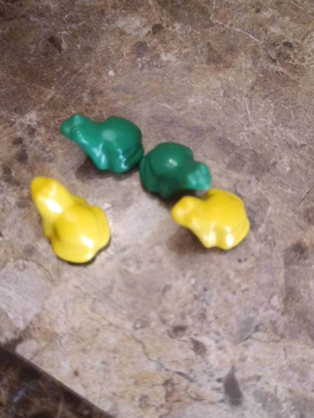 LEGO frogs (Part 33320), a small, stylized molded plastic animal piece produced